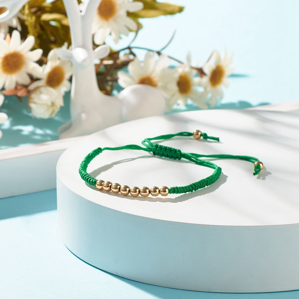 Bracelet cordon tressé et perle doré amitié