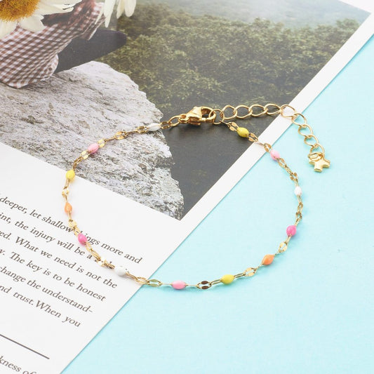 Bracelet acier inoxydable or maille émaillé rose orangé